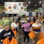 Relocation Today team volunteering at The Food Group in Minnesota, supporting Zero Hunger and sustainability efforts.
